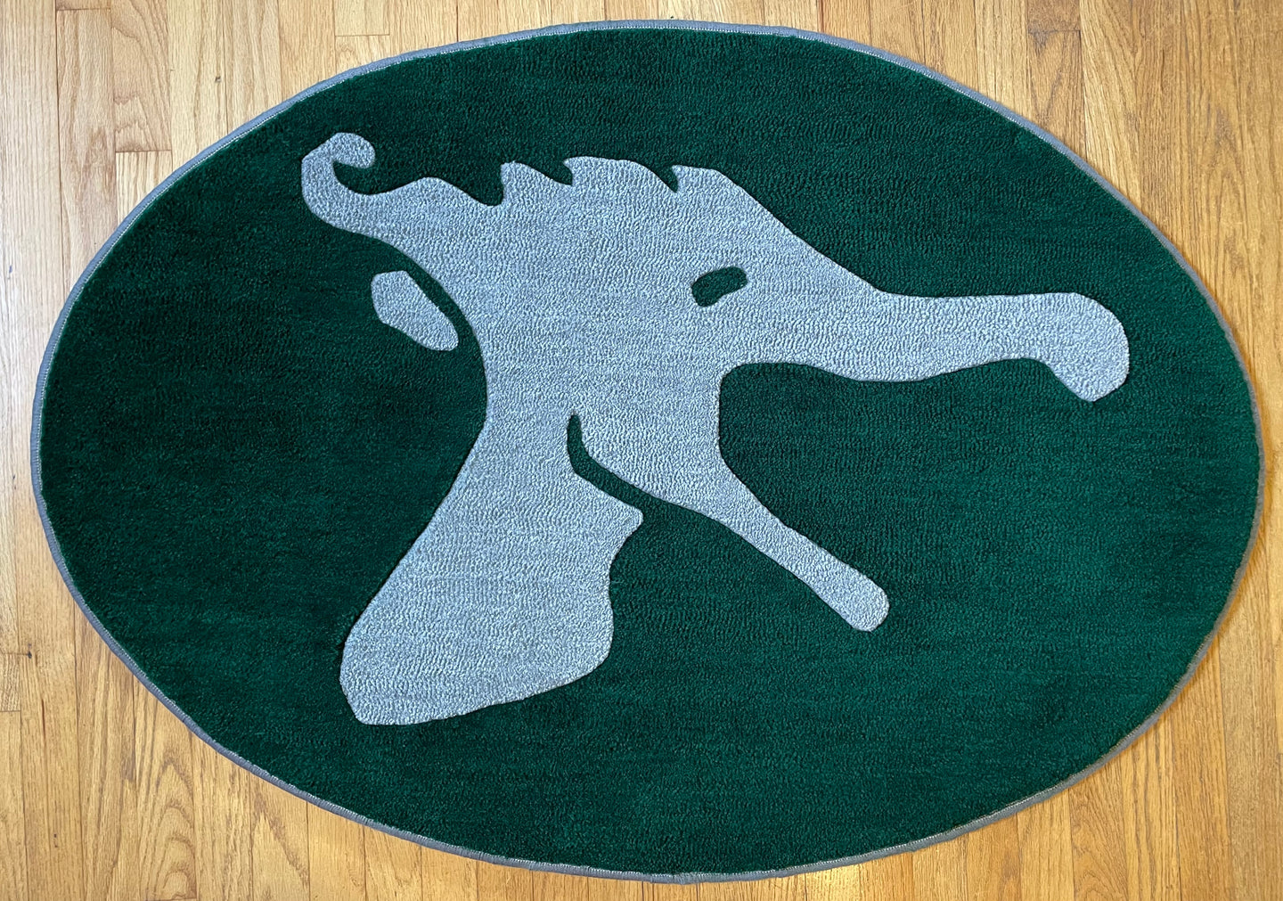 Camp Lanakila logo. This rug was a gift for their 100th year celebration