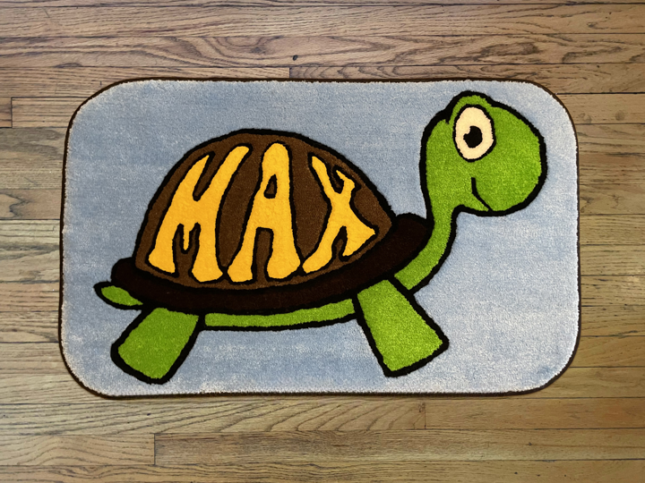 MAX rug pictures in Sky blue and Sunflower lettering